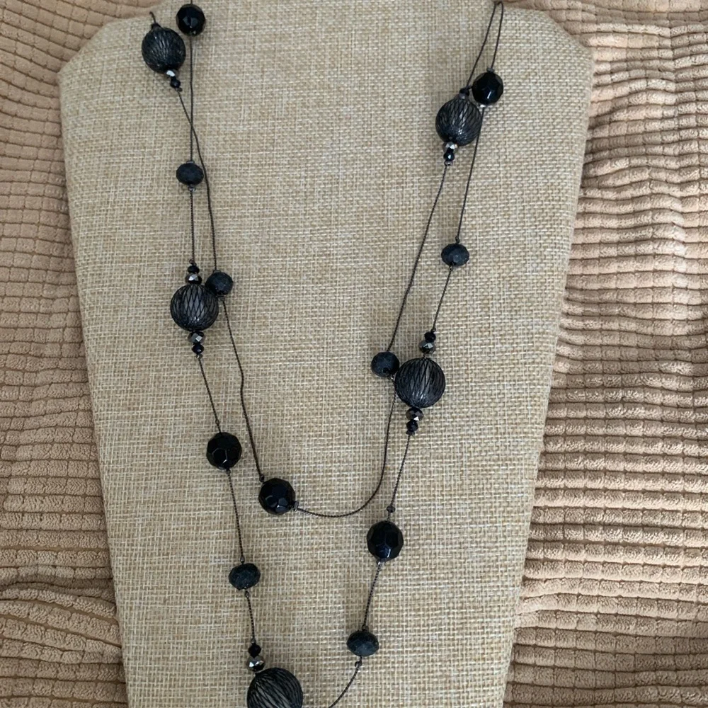 Long elegant black necklace with net over glass beads
